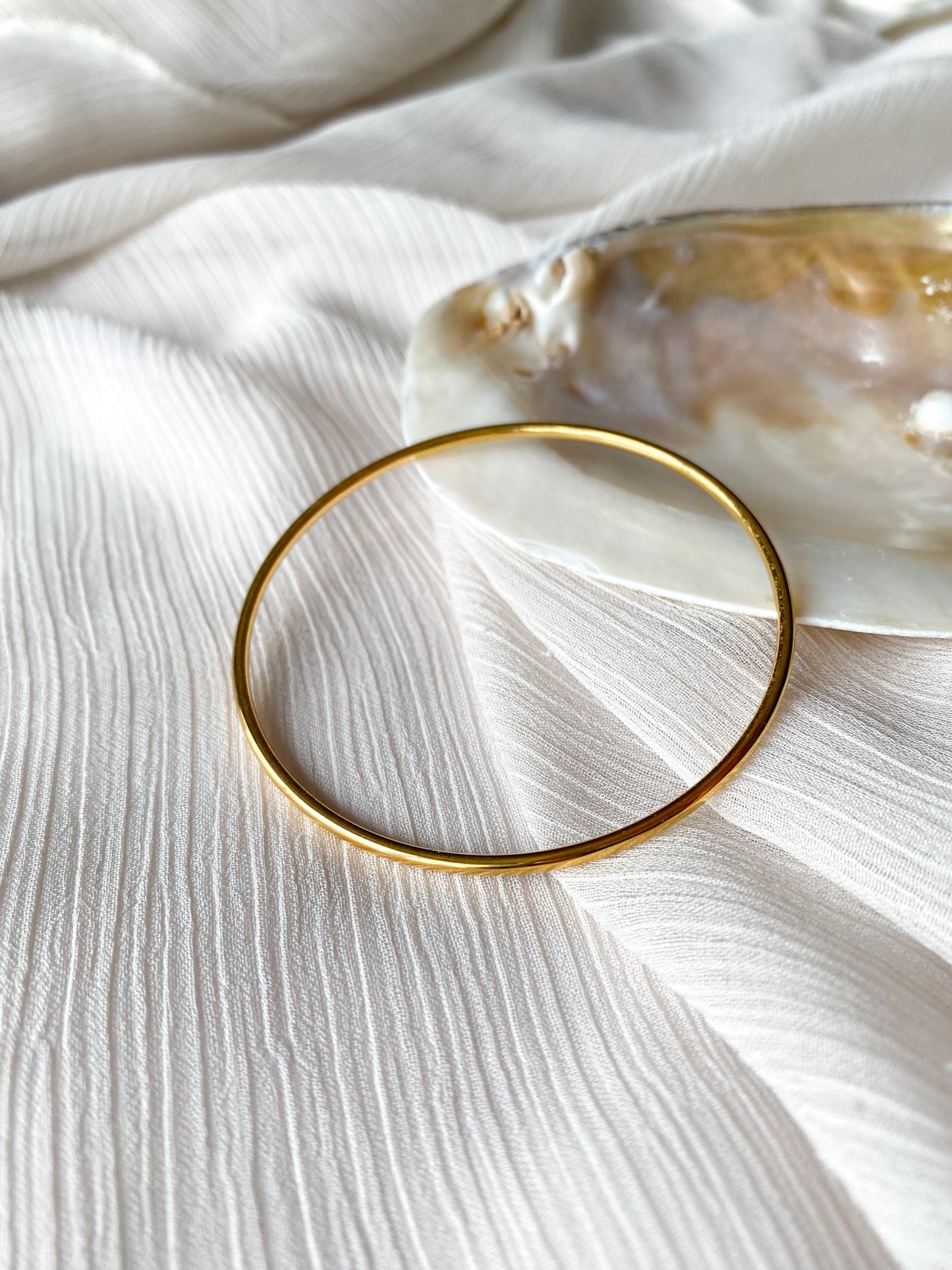 Escrava dourada em aço inoxidável